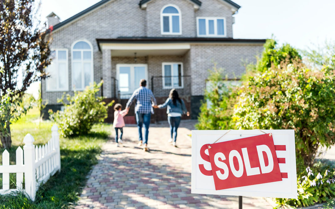 Home for sale with yard sign